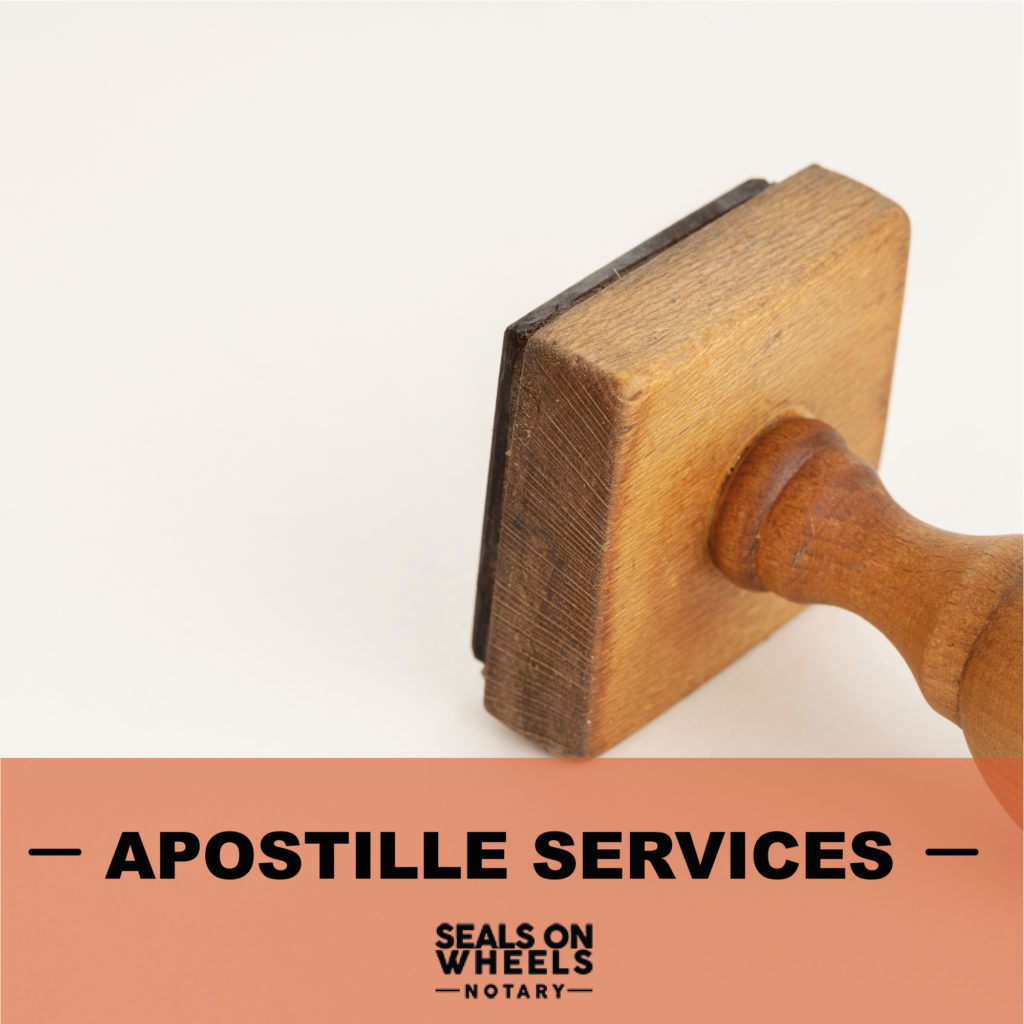 A wooden stamp with the words " apostille services ".